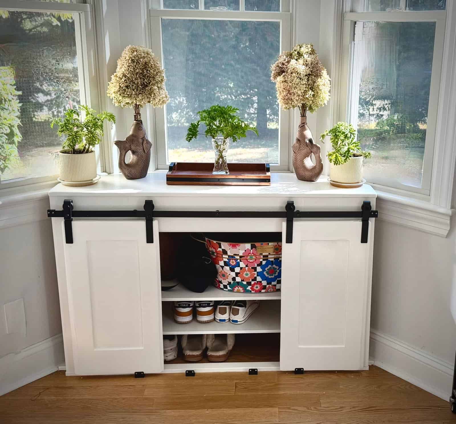 Upcycled cupboard doors on a drop zone cabinet with shoes inside